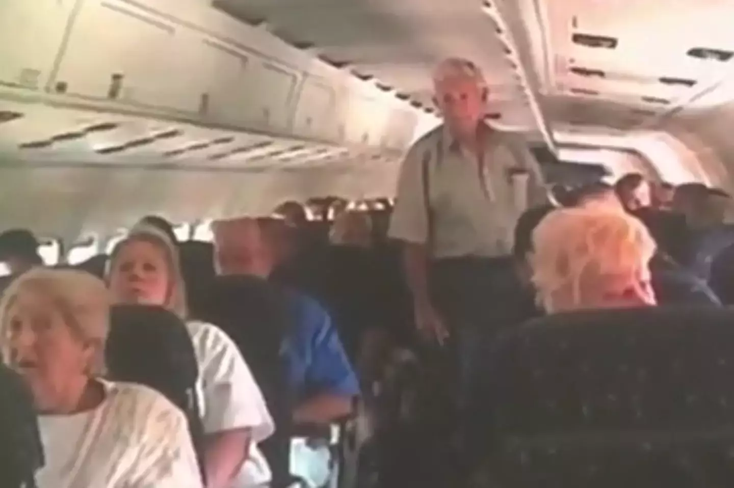 Footage captured the chilling reactions of plane passengers on 9/11 being informed about attacks 1 The passengers were left stunned by the announcement (Frank Pizzo/CTTV)