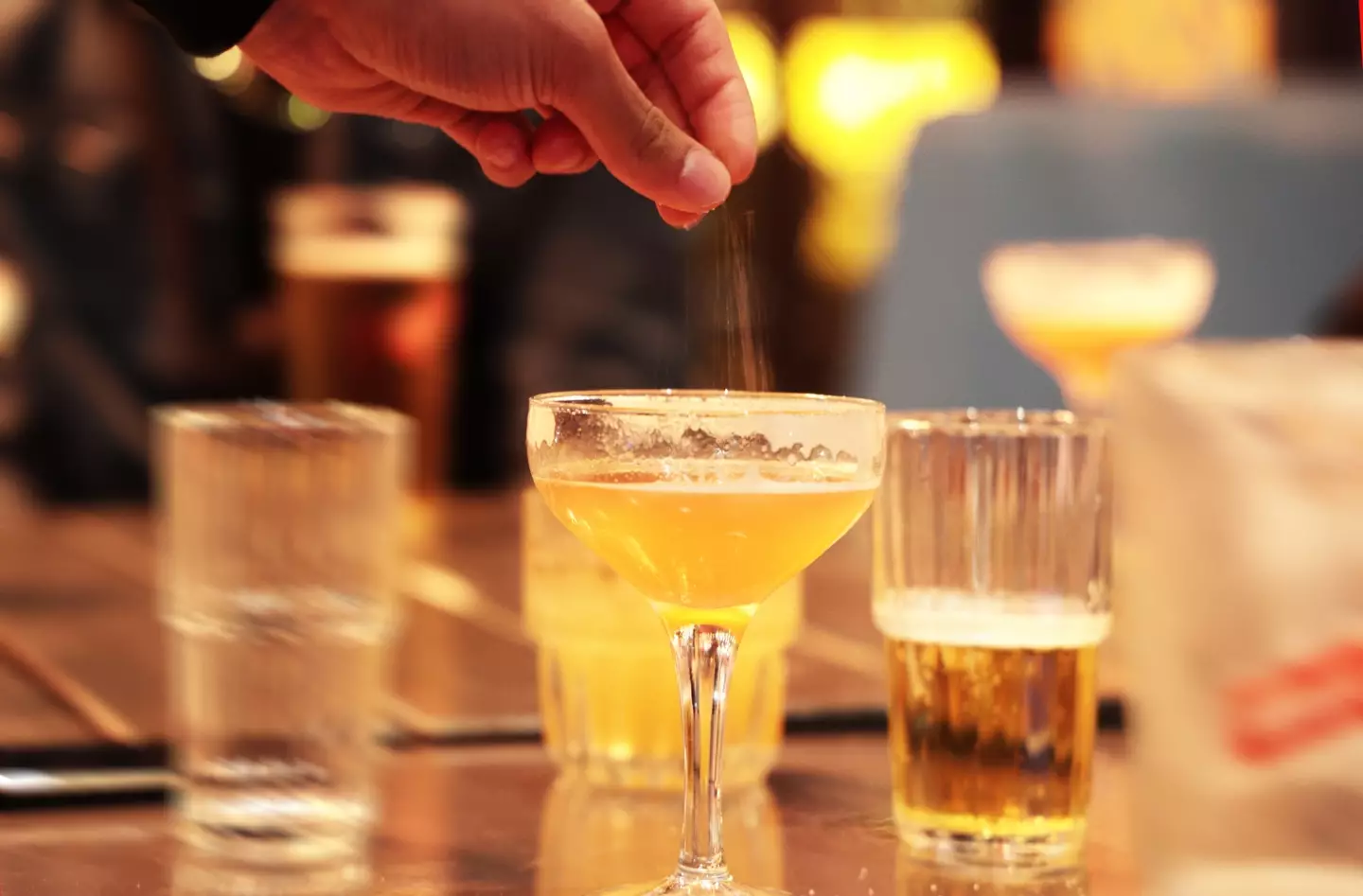 Cocktail being spiked in a bar (Getty Stock)