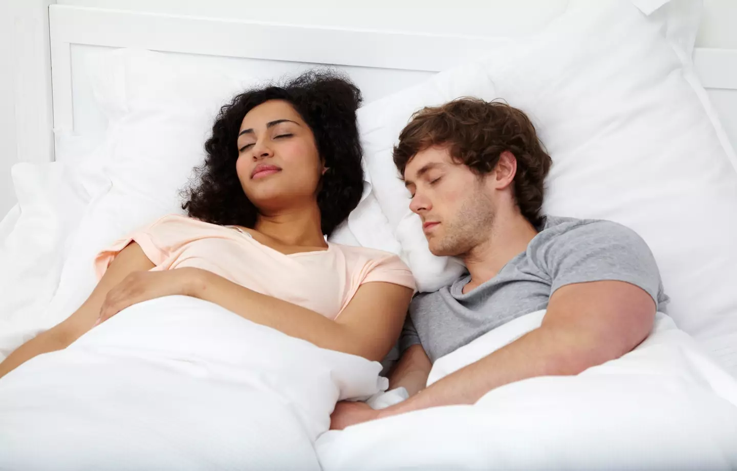 "They're fast asleep, maybe if I just pretend to be asleep it'll work out." (Getty Stock Photo)