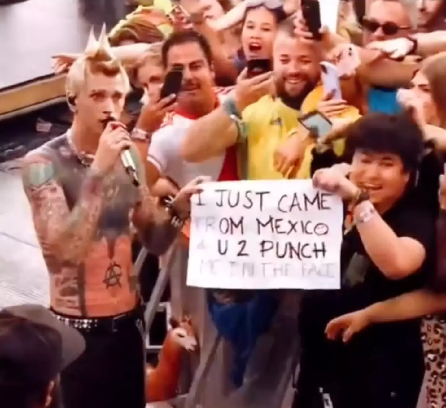 The fan flew all the way from Mexico to Belgium in the hopes of getting a punch from MGK.