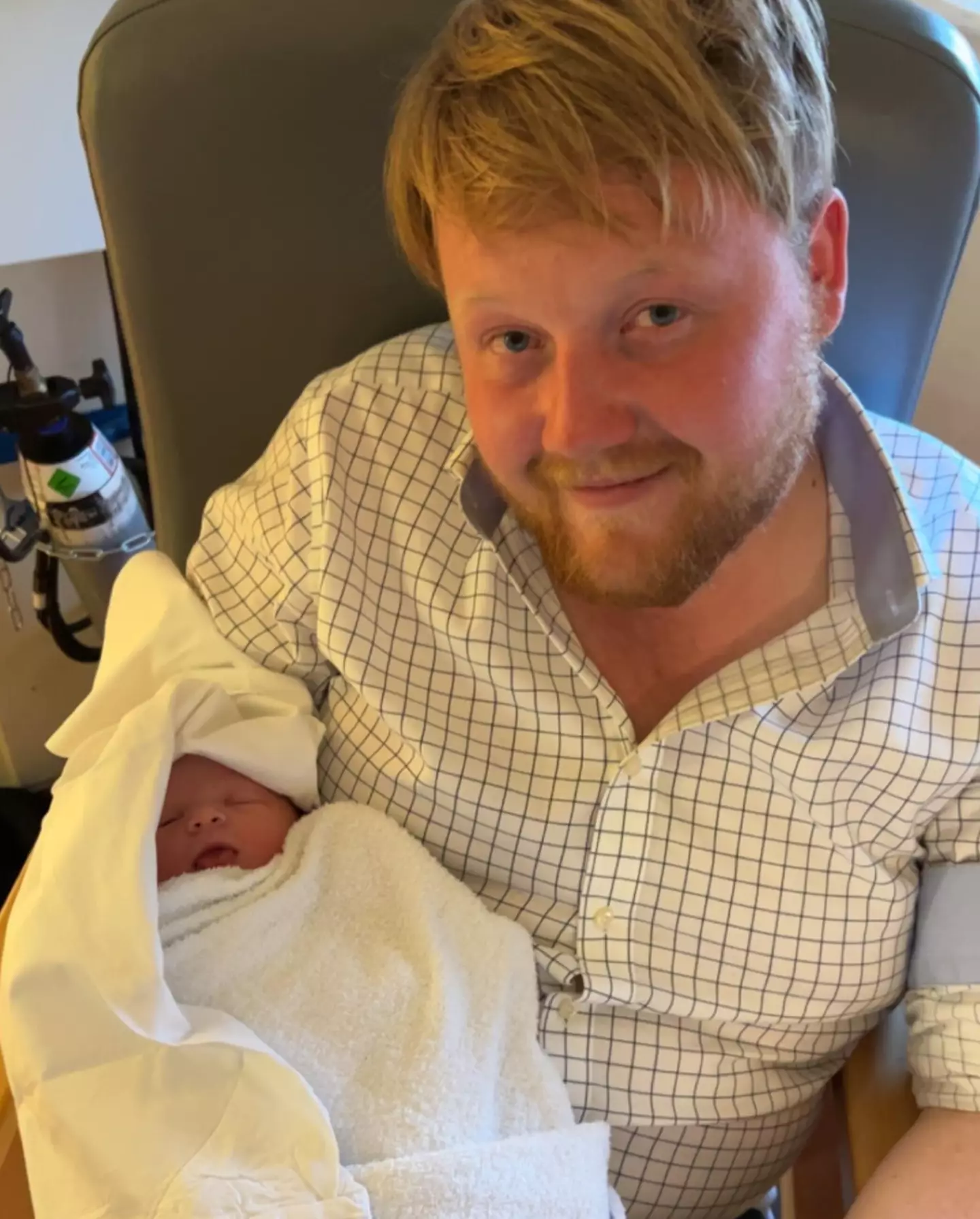 Cooper with his newborn daughter, Willa Grace Cooper.