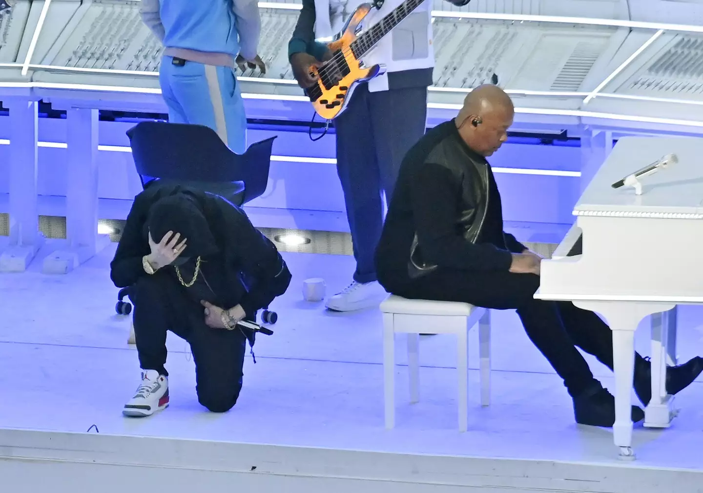 Eminem took a knee during the performance.