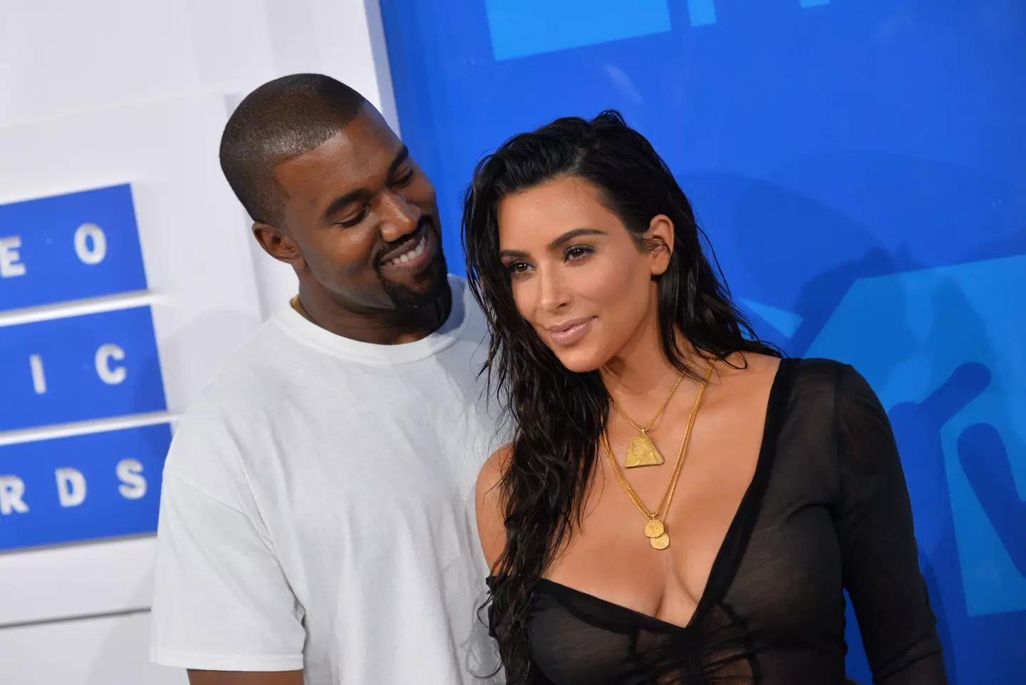 Allegations claim Kanye showed staff members naked pictures of his ex-wife Kim Kardashian.