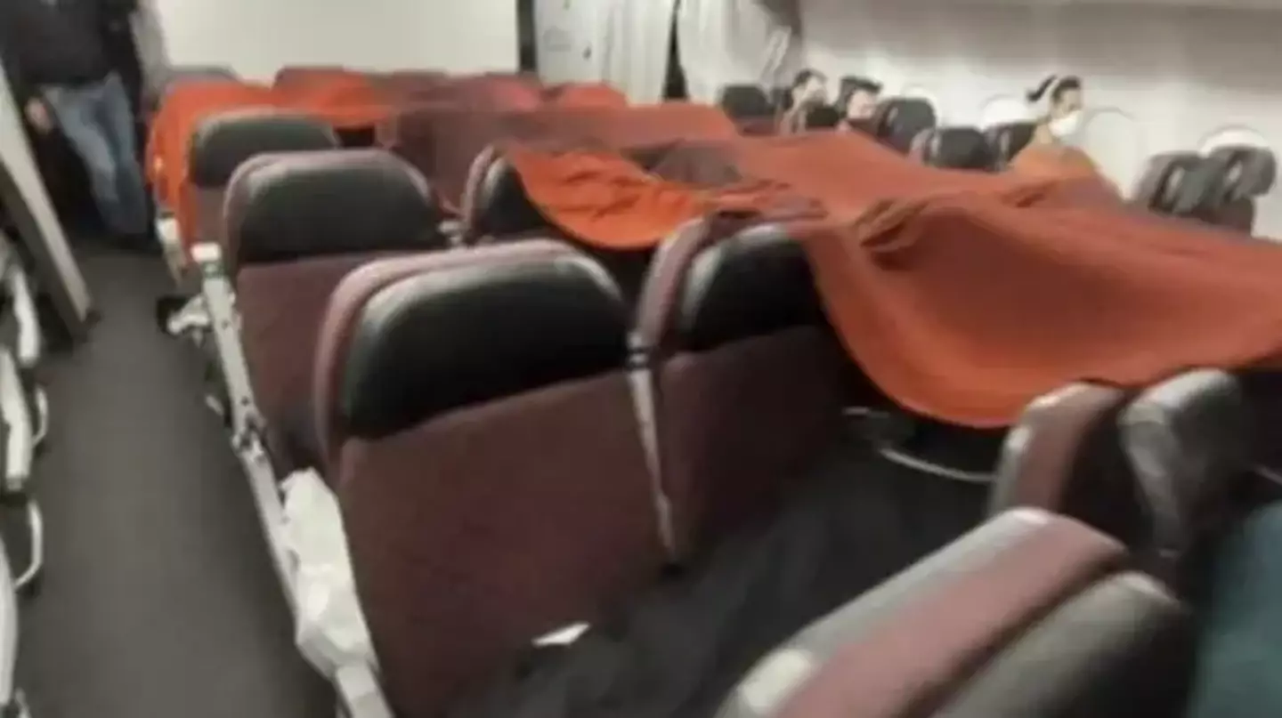 Cabin crew were forced to sleep under makeshift blanket forts.