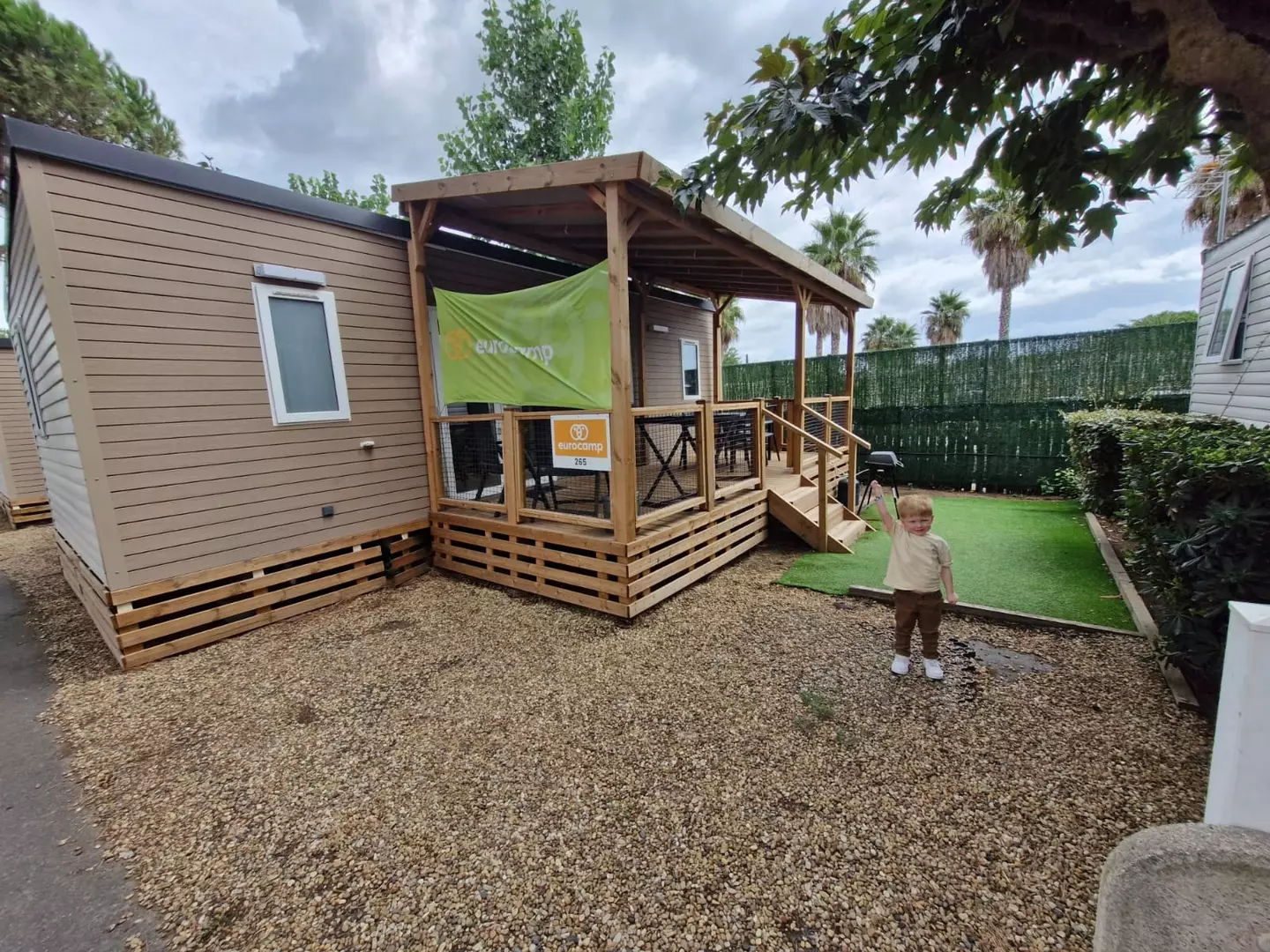 My lad Henry outside out Eurocamp cabin at Club Farret (LADbible)