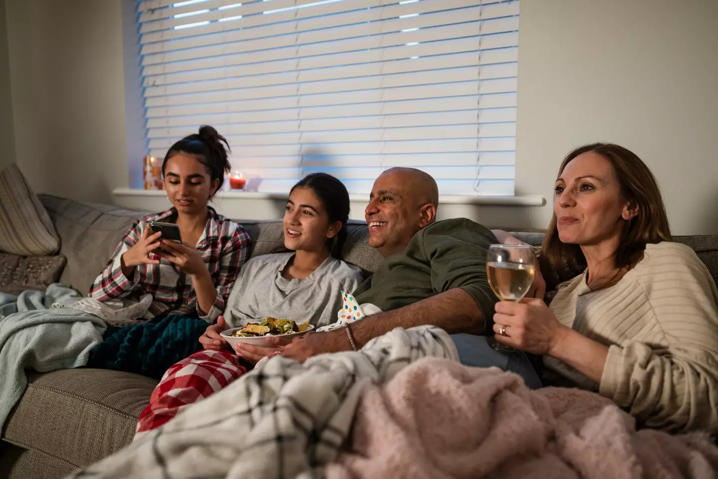 We all love watching a Christmas film (Getty Stock)