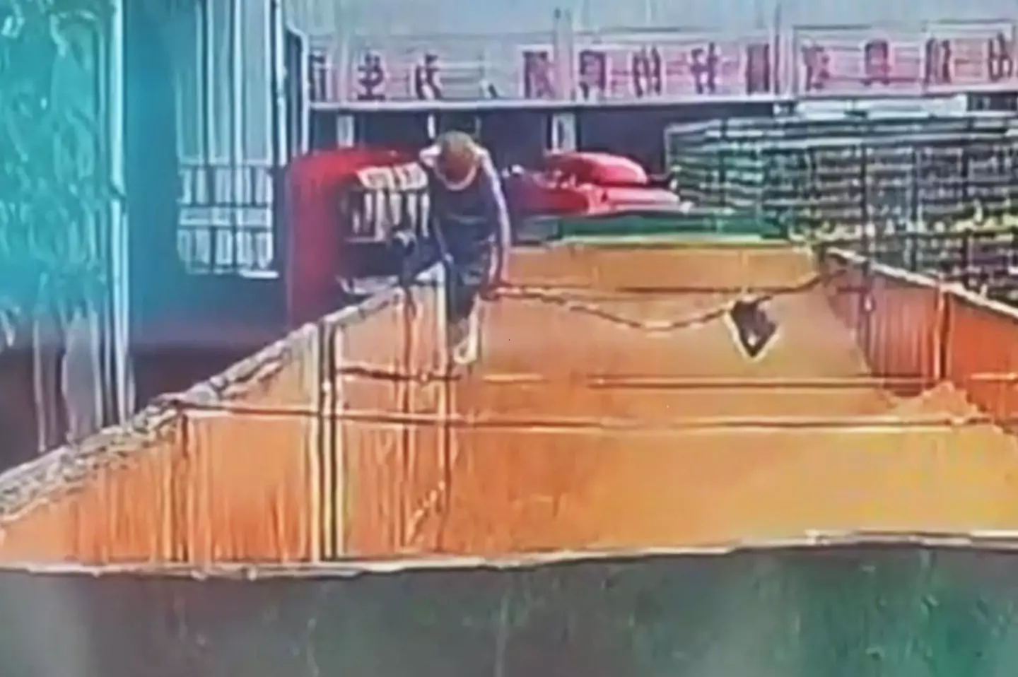 The man was caught on camera clambering into the back of a brewery delivery truck.