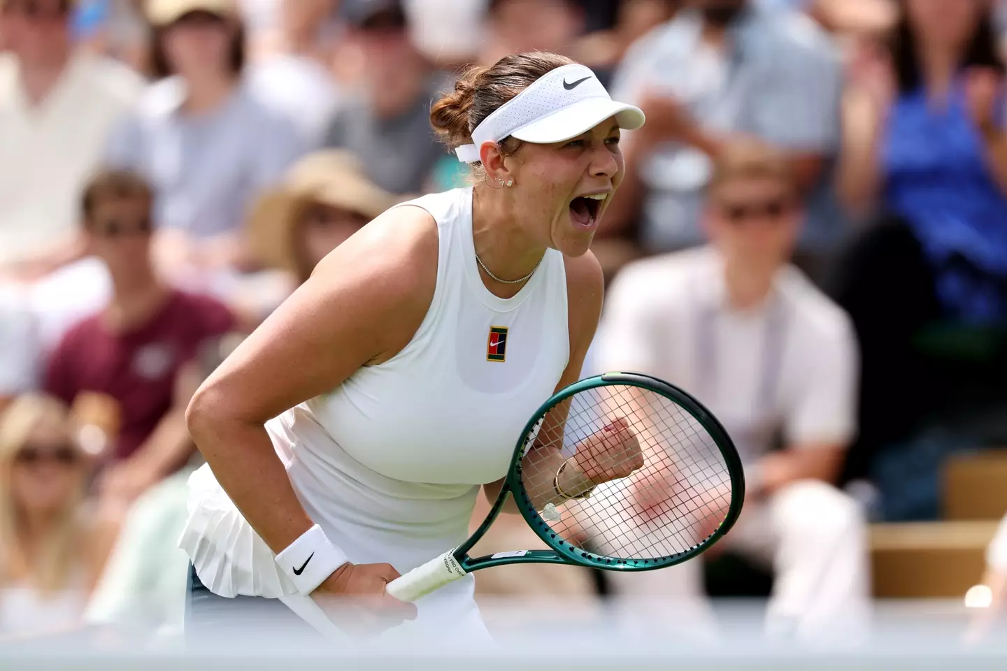 Amanda Asimova's serve was disrupted by an uncorked champagne bottle (Clive Brunskill/Getty Images)