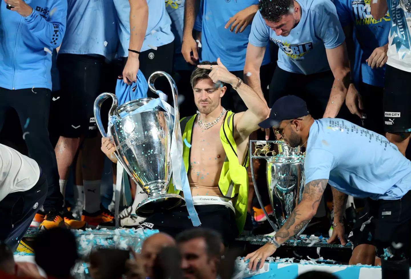 Jack Grealish chilling with the CL trophy.