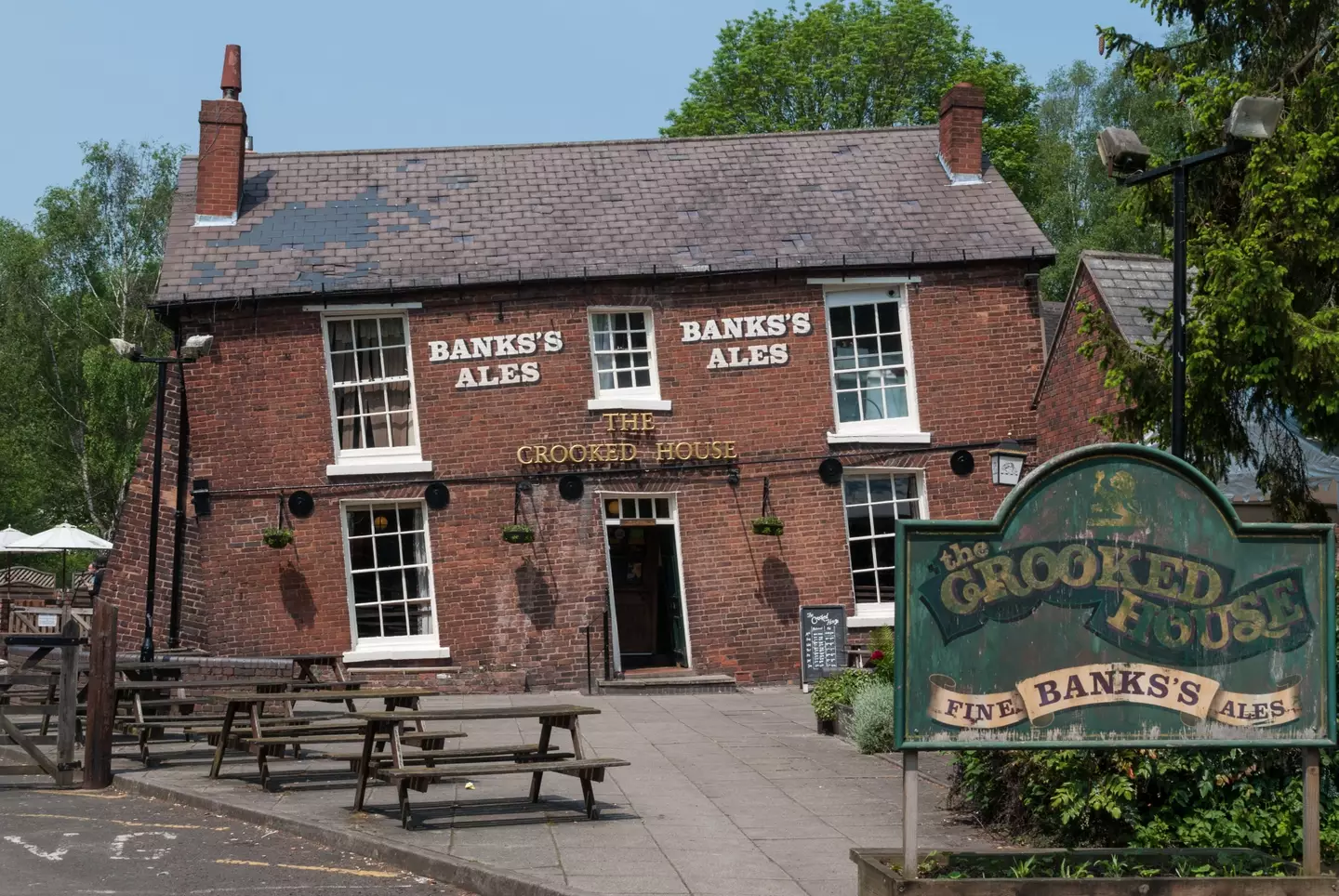 Police are treating the fire at the famous Crooked House pub as arson.