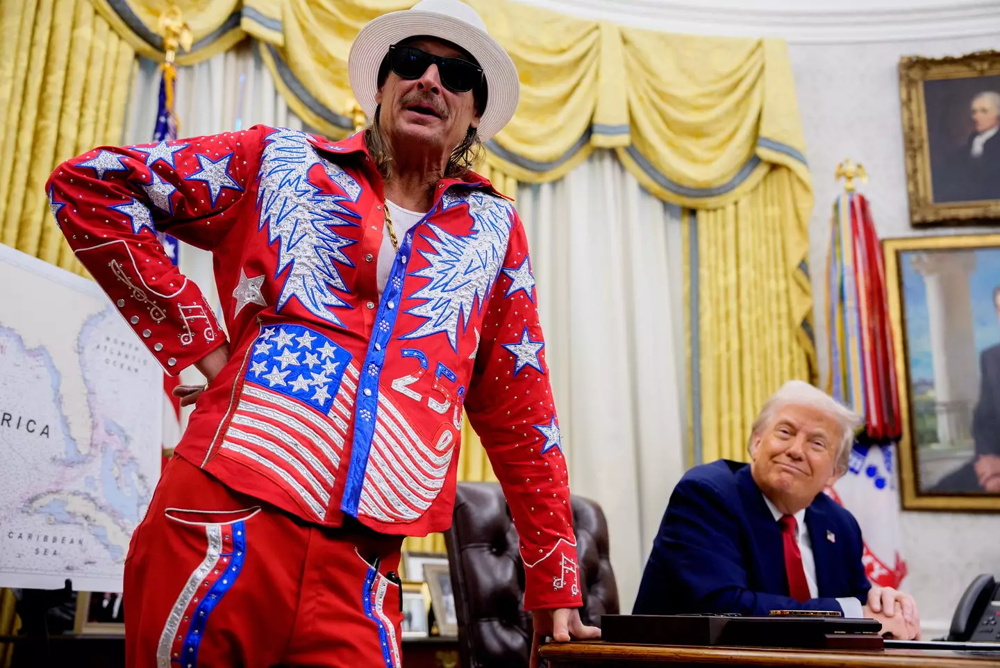 Kid Rock, pictured with Trump in March last year, is among the performers taking to the stage at the 'All-American' gig (Andrew Harnik/Getty Images)