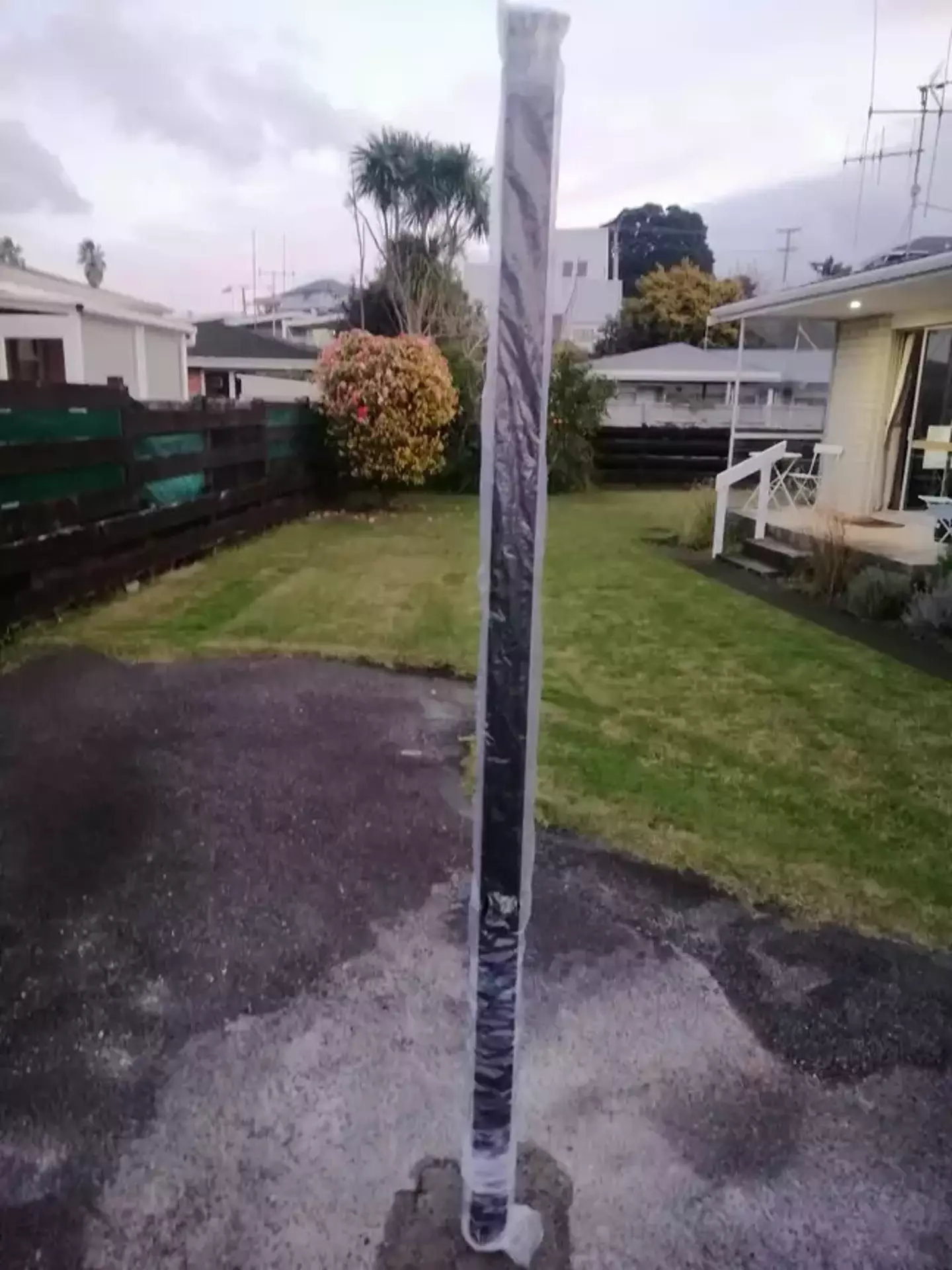 A New Zealand woman has finally discovered who is responsible for mysteriously erecting a 6ft pole in her driveway.