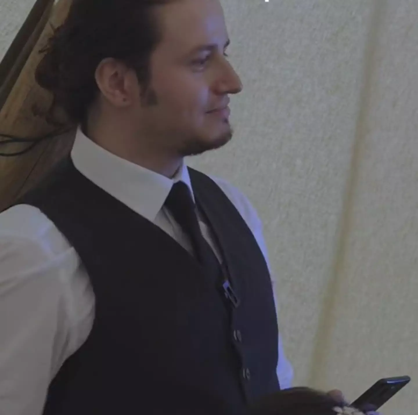 The face of a best man who knows he's done a good job with his speech and it's time to wrap things up.