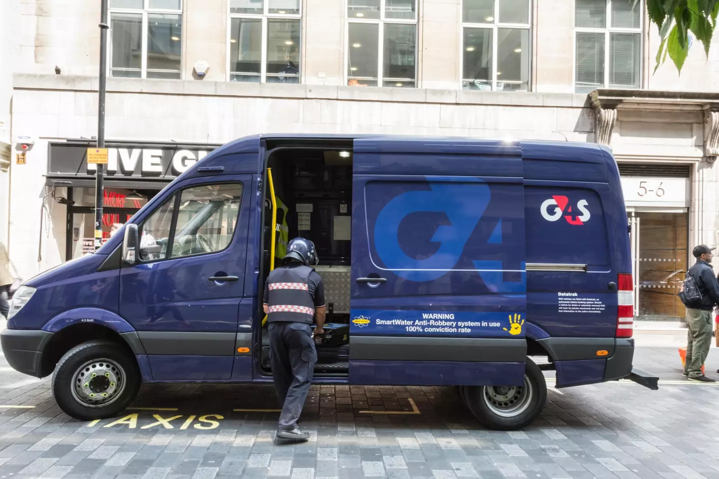 A bank robber posing as a G4S security guard walked away with £150k in cash.