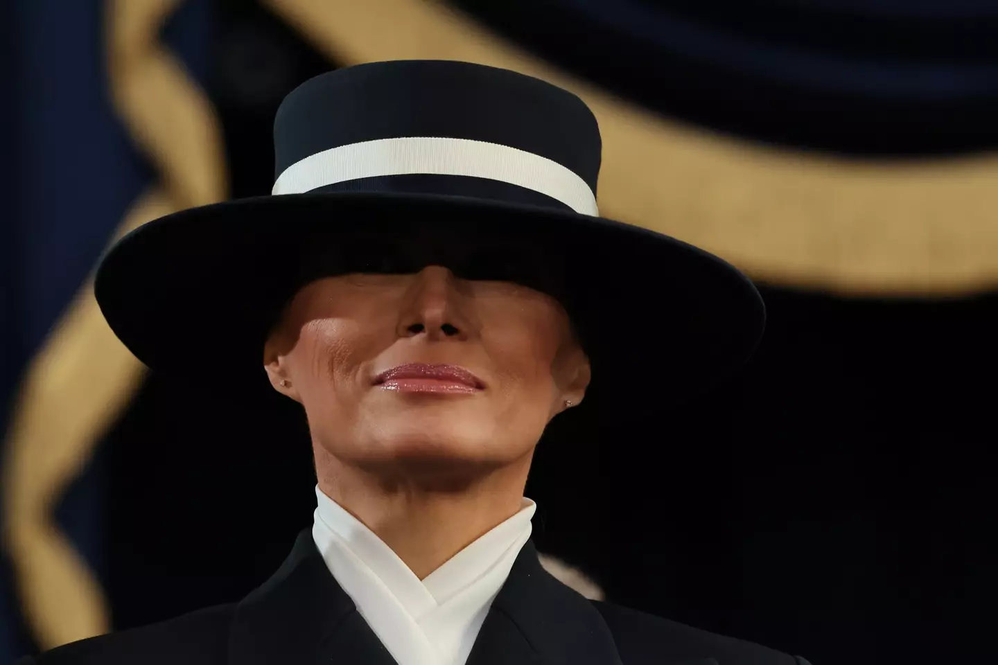 Melania and her hat or 'shield'? ( Chip Somodevilla/Getty Images)