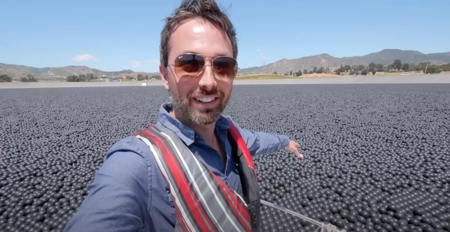Taking a boat out into a sea of plastic balls does look pretty fun. (YouTube/ Veritasium)