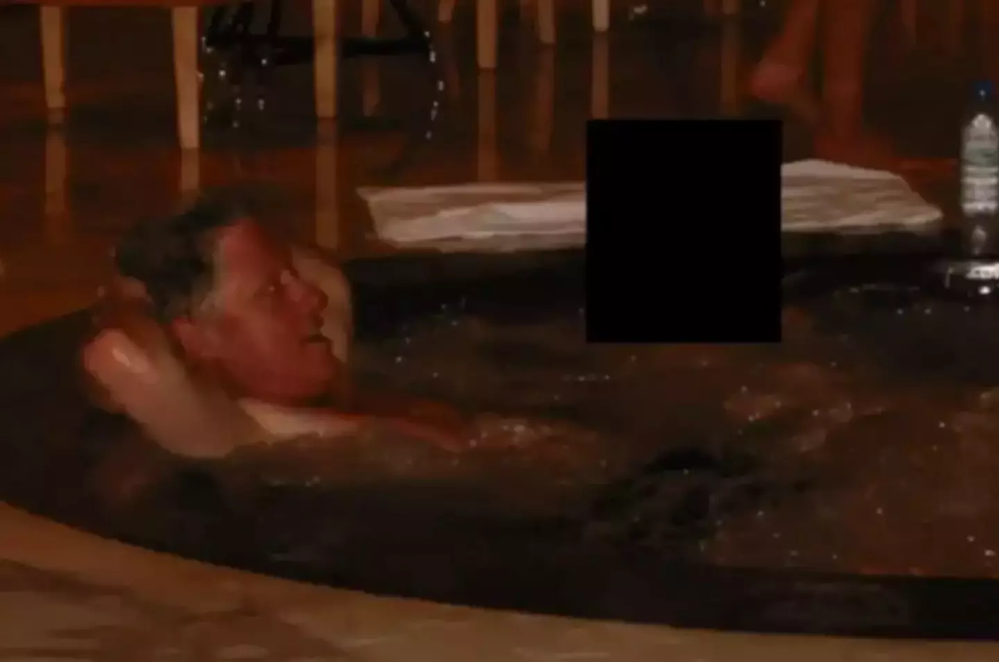 One snap appeared to show the former president lounging in a hot tub (US Department of Justice)