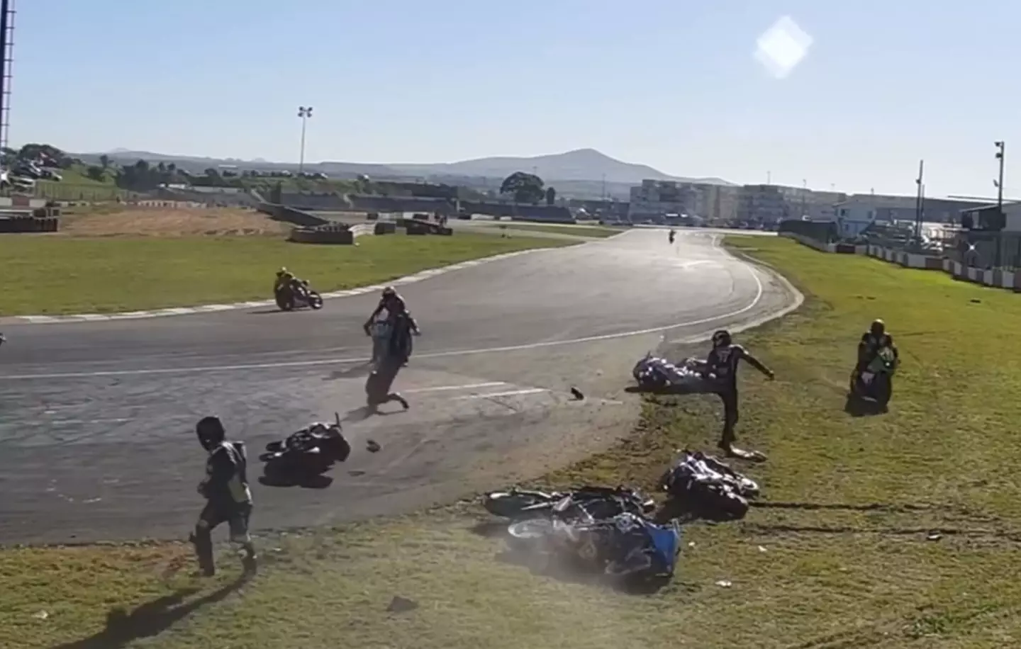 One bike's fuel leaked onto the track, causing riders to slip.