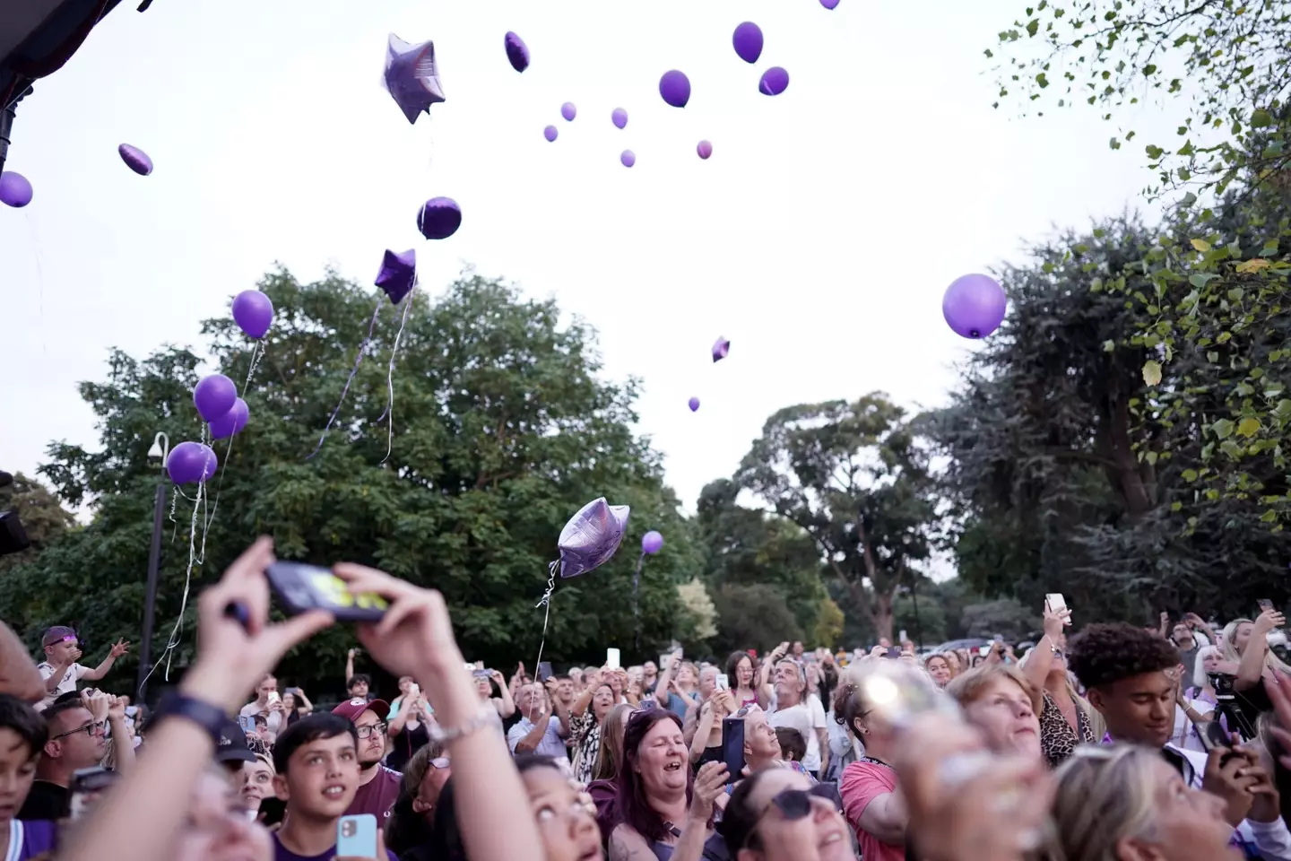 Attendees at the vigil released purple balloons into the sky.