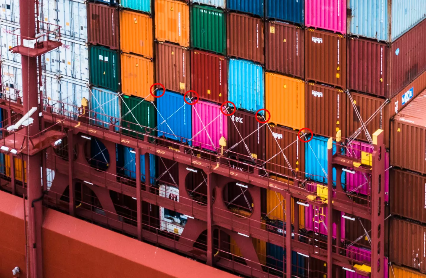 You can see how the containers are secured to the ship with metal bars here (Getty Stock Image)