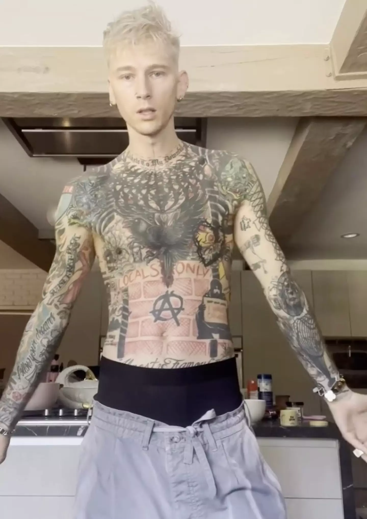 The rapper's body was previously adorned in various designs which he now considers 'chaotic' (Instagram/@machinegunkelly)