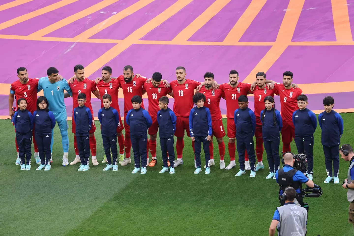 The players stood in silence during the national anthem.