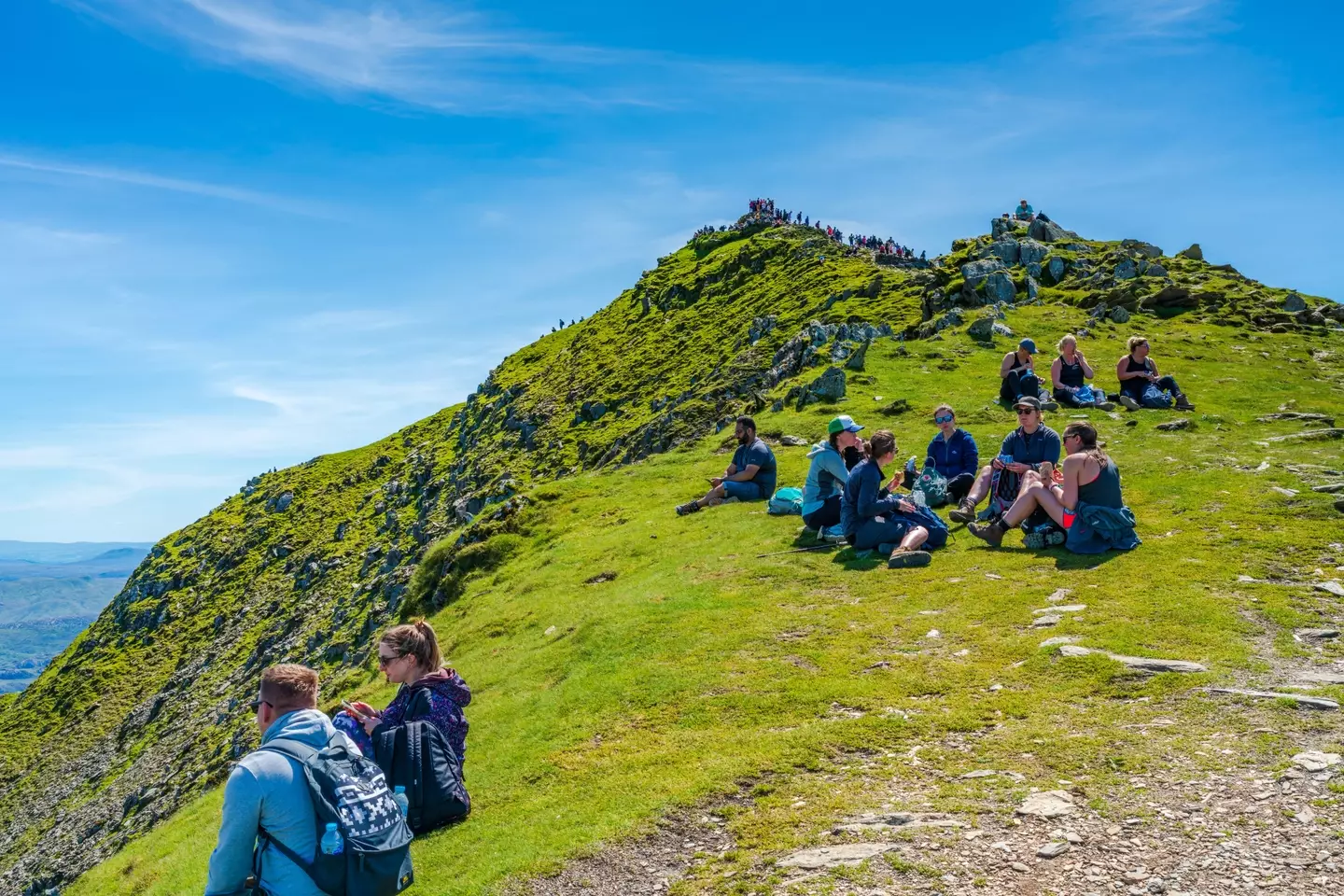 The mountain attracts thousands of visitors every year.