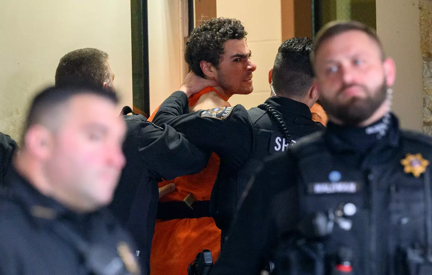 Luigi Mangione shouted to reporters as he was led into the Pennsylvania court (Jeff Swensen/Getty Images)