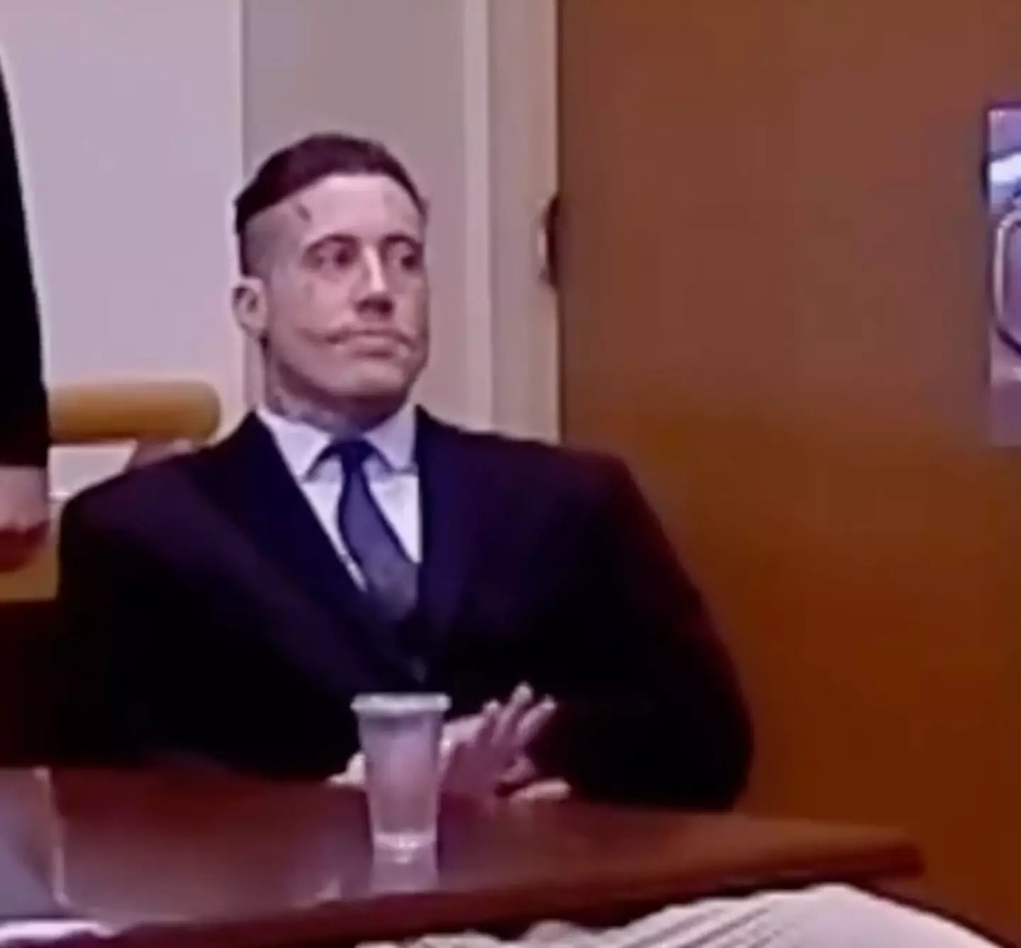 The killer was seen making a strange hand gesture at the sentencing hearing (TikTok/@chroniclesofolivia)
