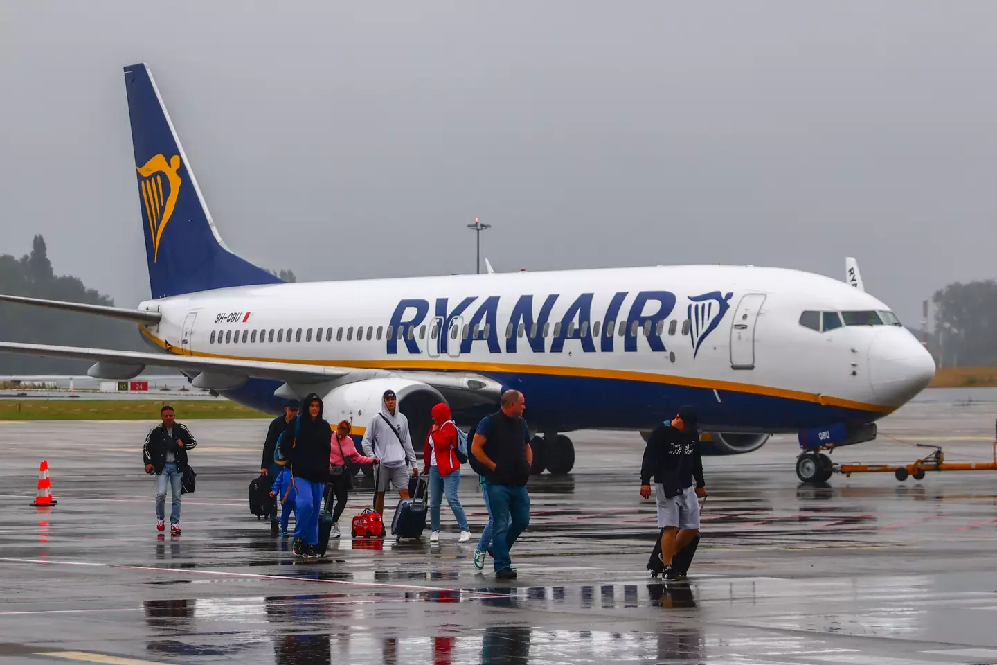 Passengers getting off a Ryanair aircraft.