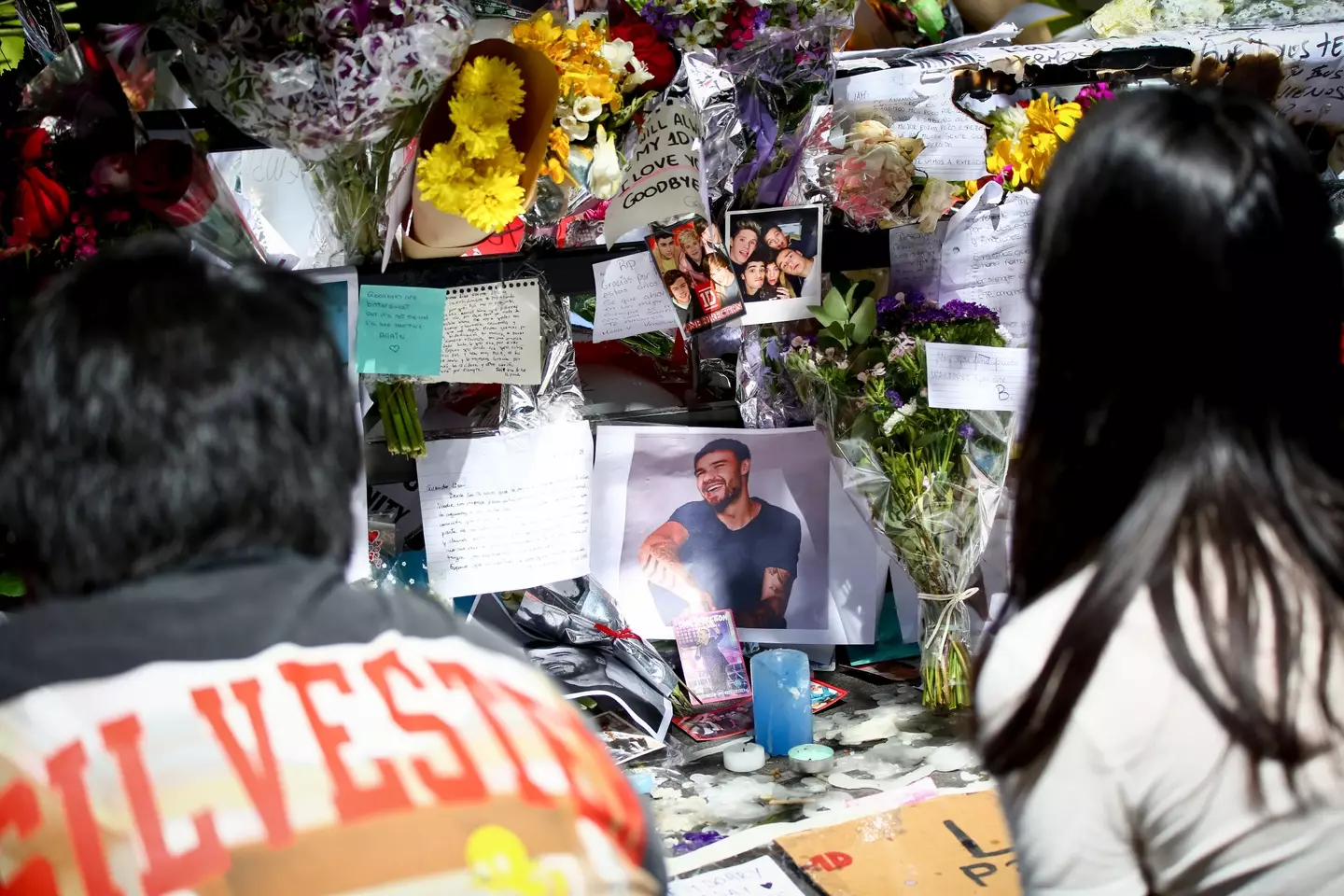Fans paid tribute to the One Direction singer outside his hotel following reports of his death (SOPA Images via Getty Images)