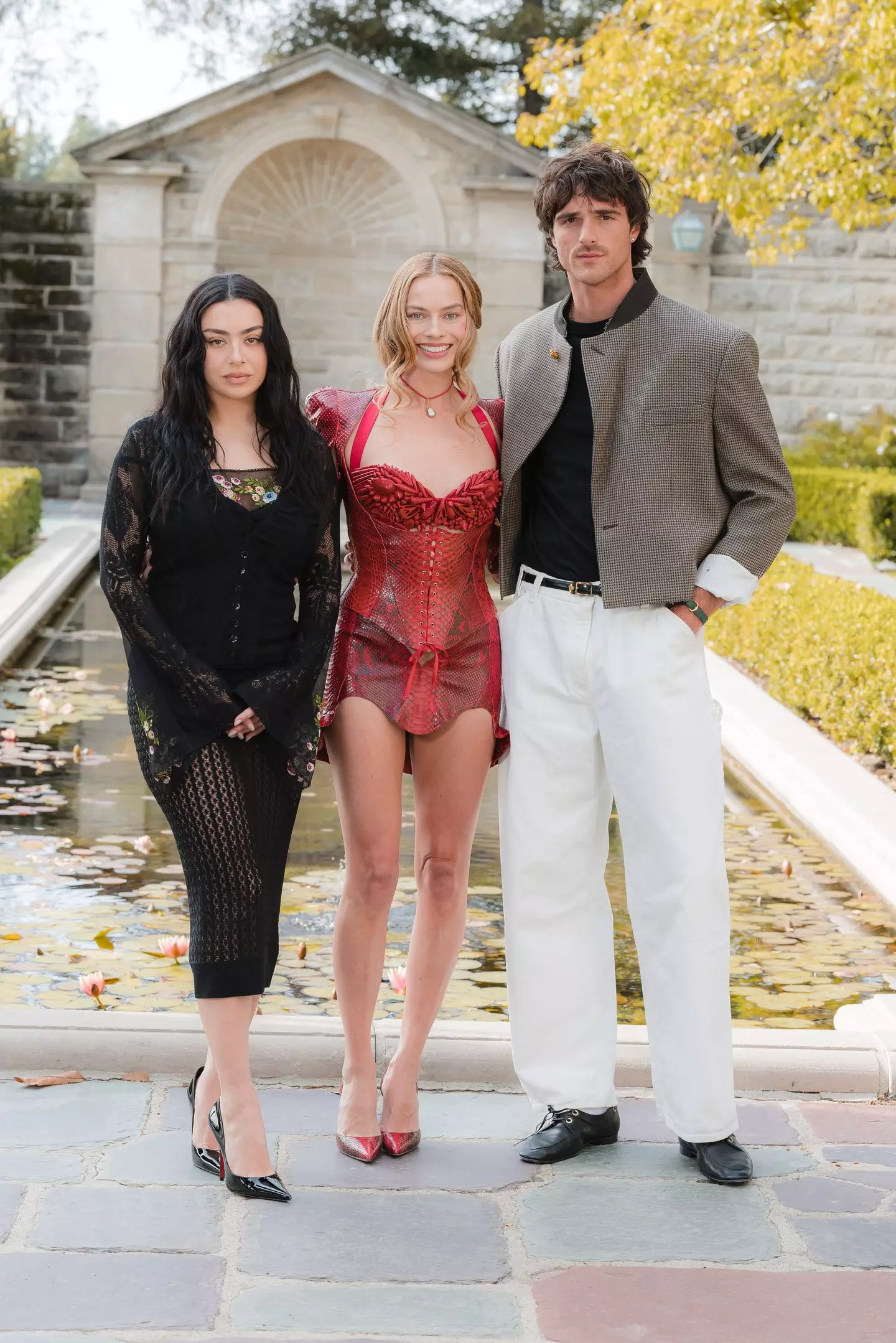 The Wuthering Heights star, pictured with Charli XCX and Jacob Elordi, said she was outraged by the unsolicited present (David Jon/Getty Images to Warner Bros. Pictures)