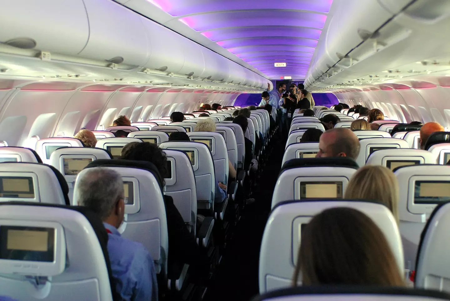 The man charged his neighbour for taking up some of his seat.