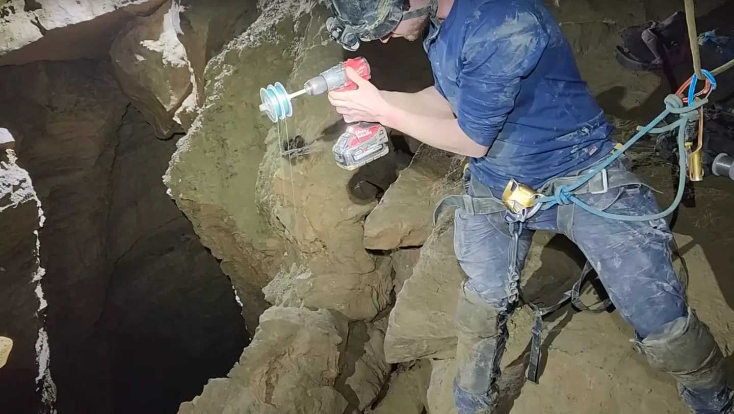 The adventurers used an electric drill to descend and ascend the camera. (YouTube/ActionAdventureTwins)