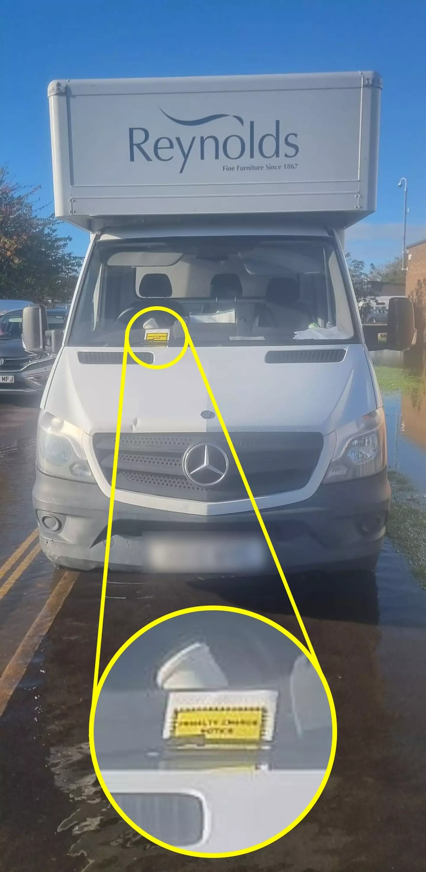 The director of a family furniture business was 'shocked' after a traffic warden slapped a parking ticket on the store's van - despite it being parked under two feet of flood water.
