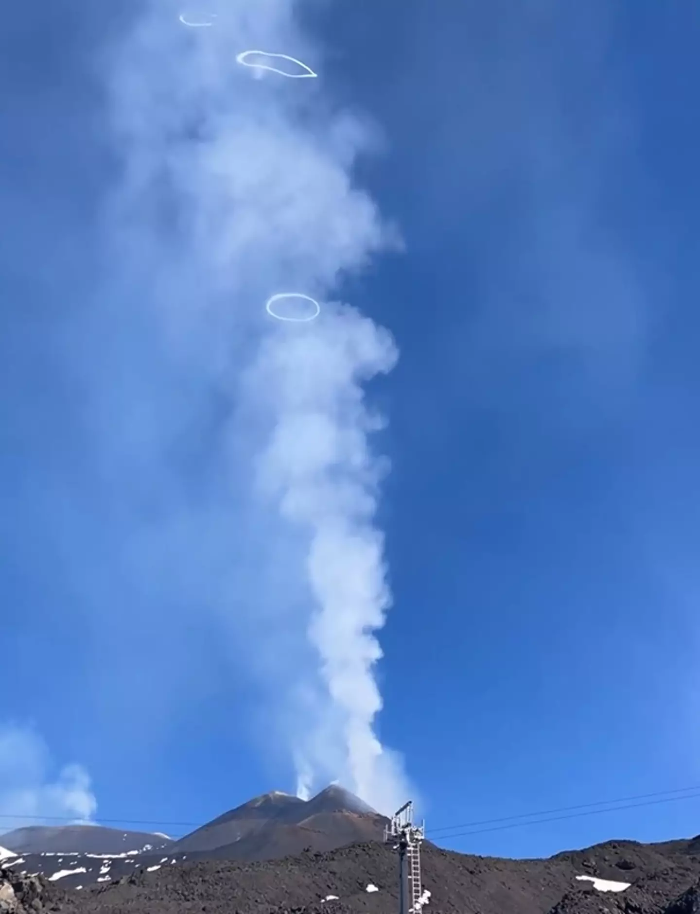 Mount Etna blowing smoke rings.