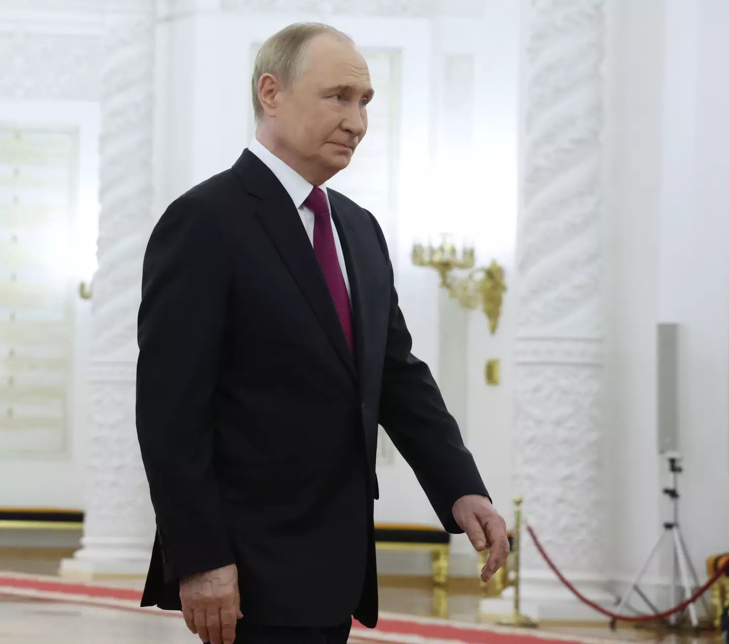 Putin's deliberate posture is designed to keep his weapon close and maintain readiness (Getty/Contributor)