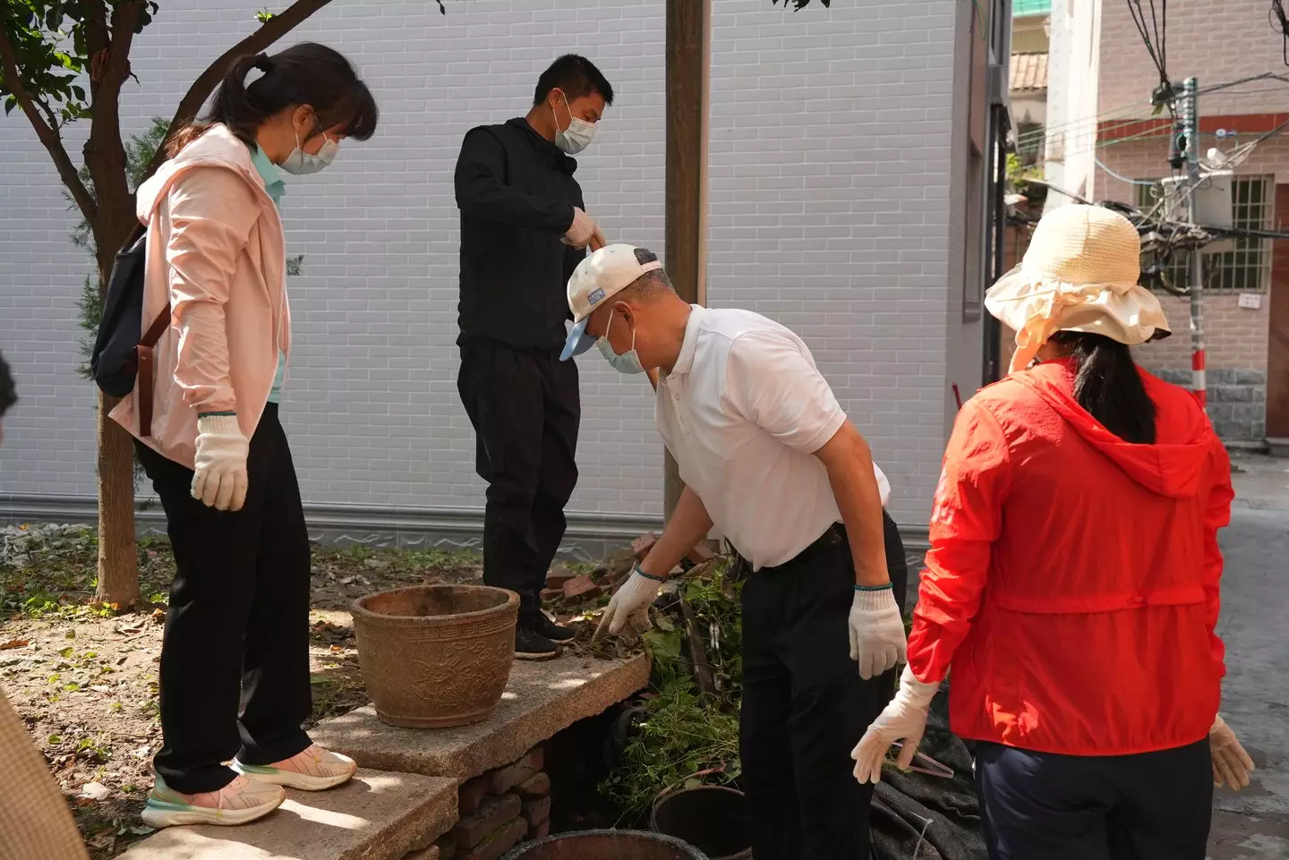 Locals are being forced to throw out stagnant water from their homes (VCG/VCG via Getty Images)
