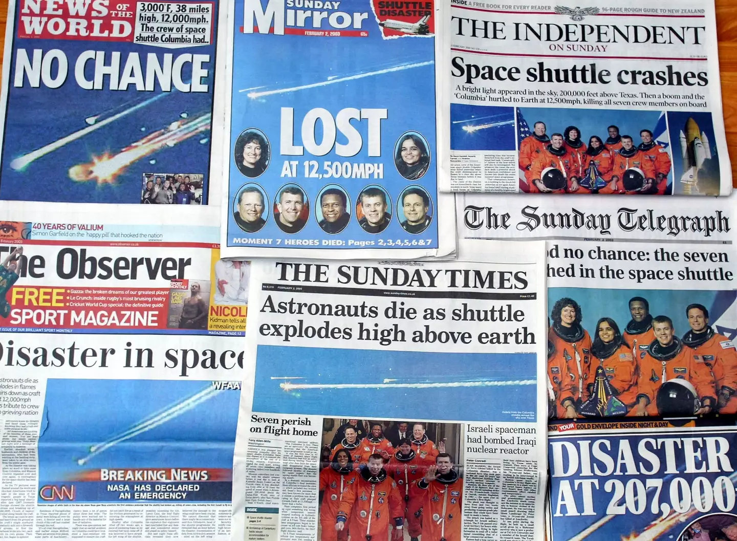 Front pages of British newspapers reporting the accident of Space Shuttle Columbia (ODD ANDERSEN/AFP via Getty Images)