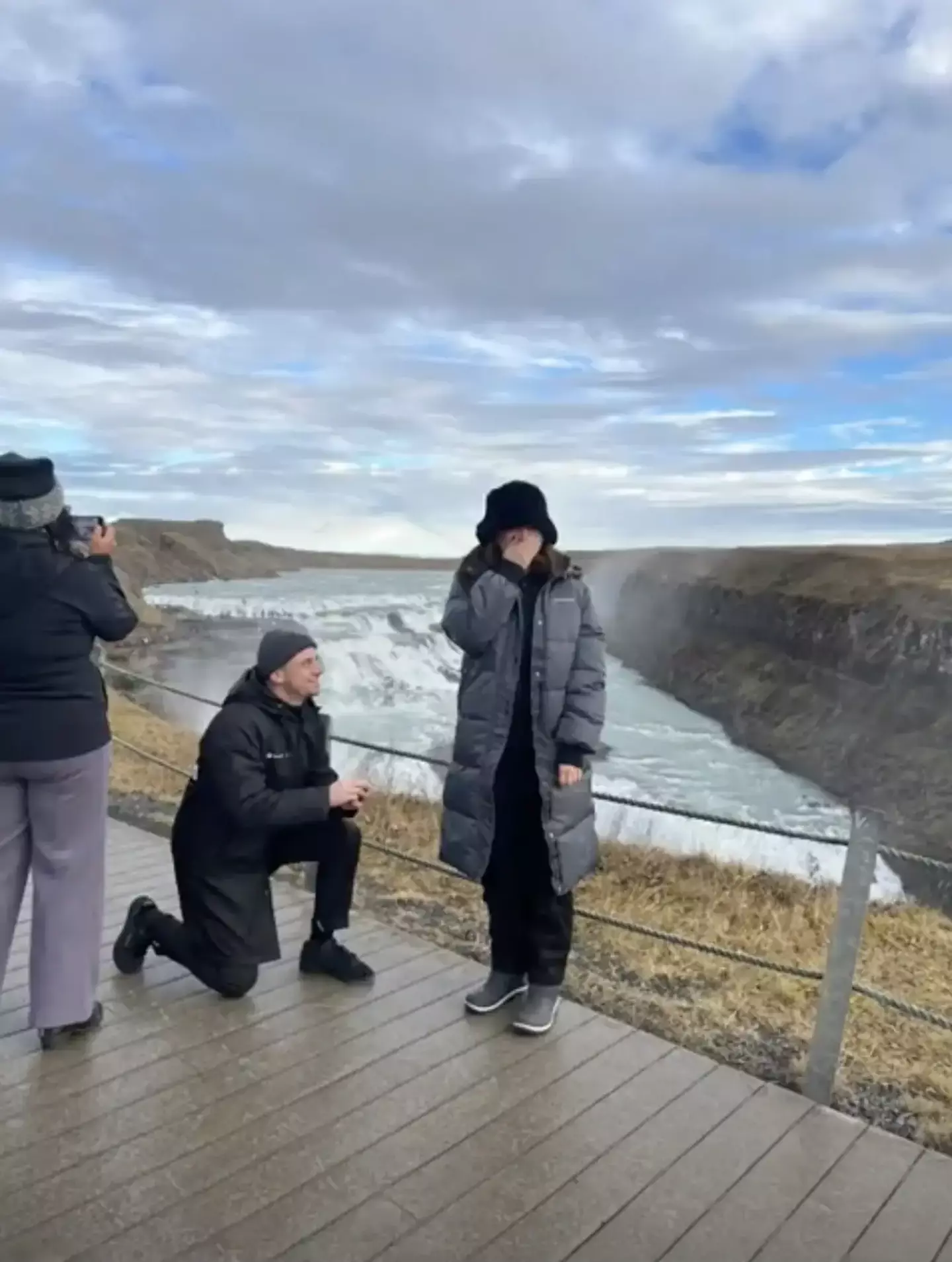 The tourist was seen taking photos of the scenery during the entire proposal.