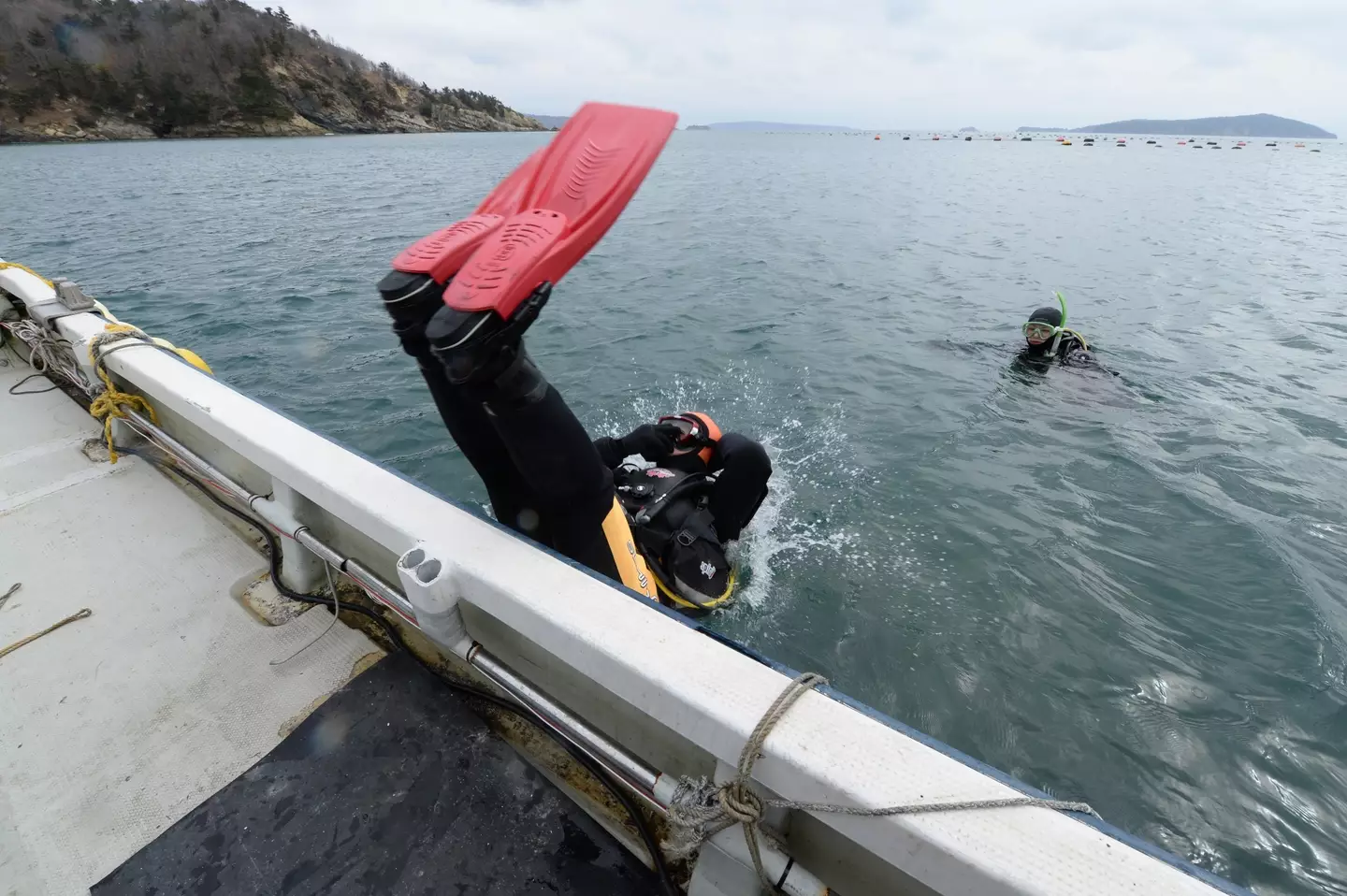 He's gone diving over 600 times to look for his wife in the past decade. (TORU YAMANAKA/AFP via Getty Images)