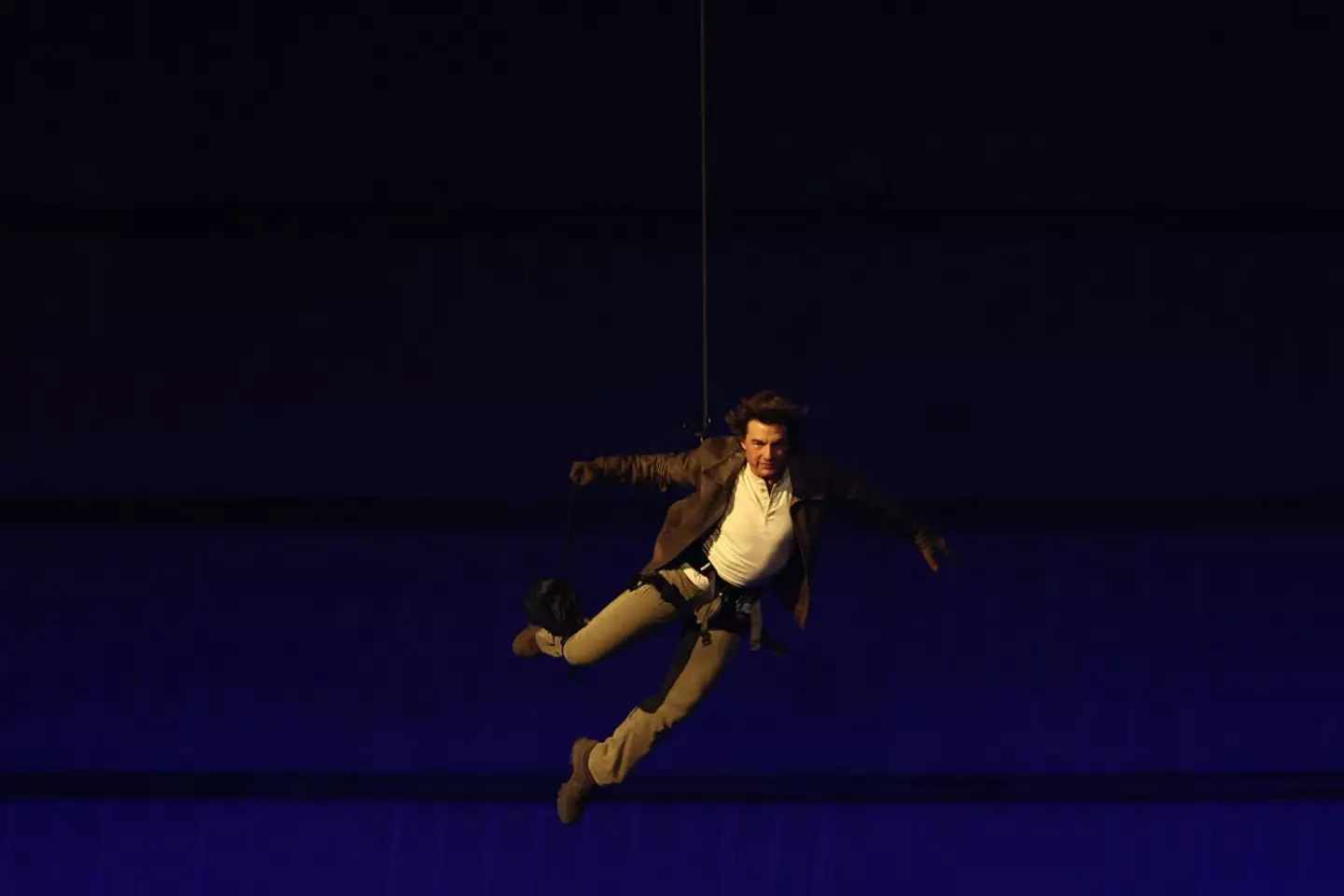 Tom Cruise made an iconic entrance into the Olympics closing ceremony. (FRANCK FIFE/AFP via Getty Images)