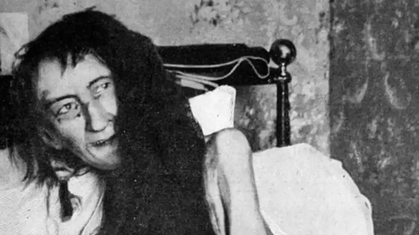 Tragic backstory behind 'most terrifying photo ever' of woman lying on her bed