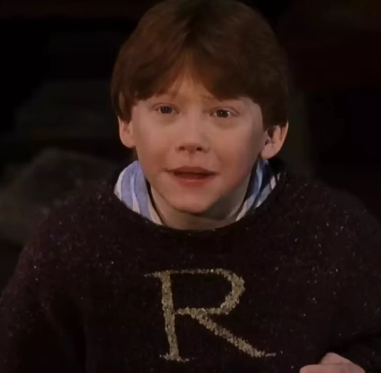 Just Ron being an icon in his Christmas Jumper. (Warner Bros)