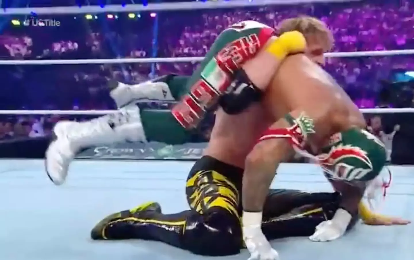 Paul managed to catch his opponent on his shoulder before he smashed into the canvas.