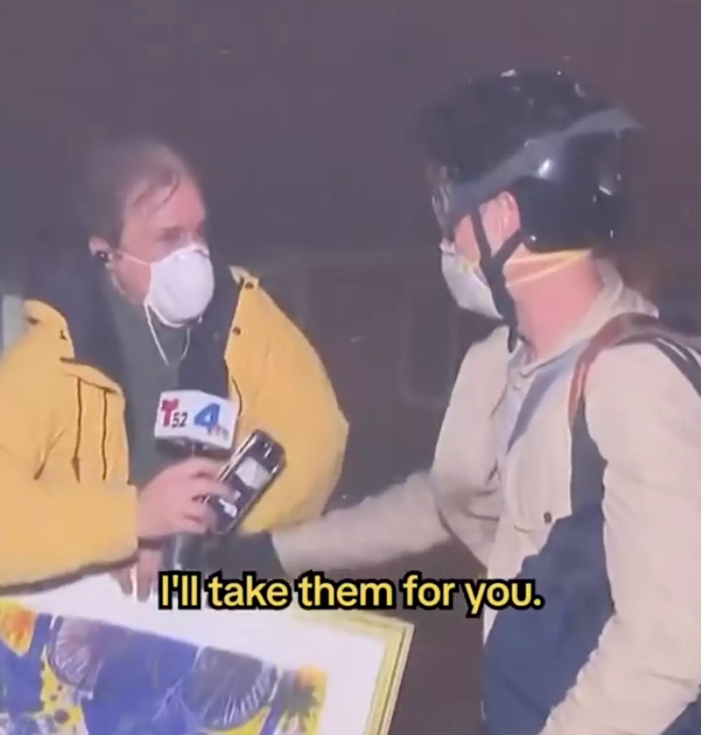 The reporter didn't hesitate to grab the man's paintings (NBC LA)