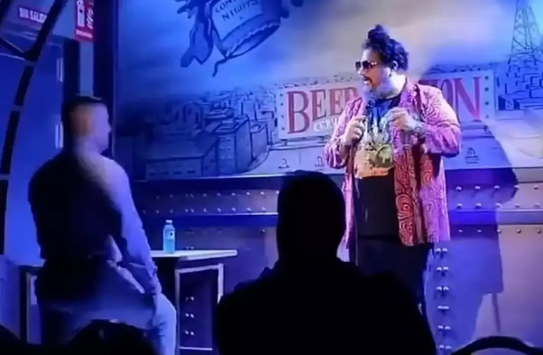 Pugilato suddenly emerged from the audience and bounded up on stage (TrimFeed via YouTube)