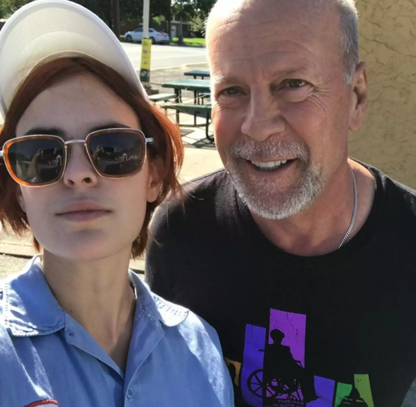 Bruce Willis' daughter hit back at a critic who questioned why she was taking pictures of her dad when he had dementia.