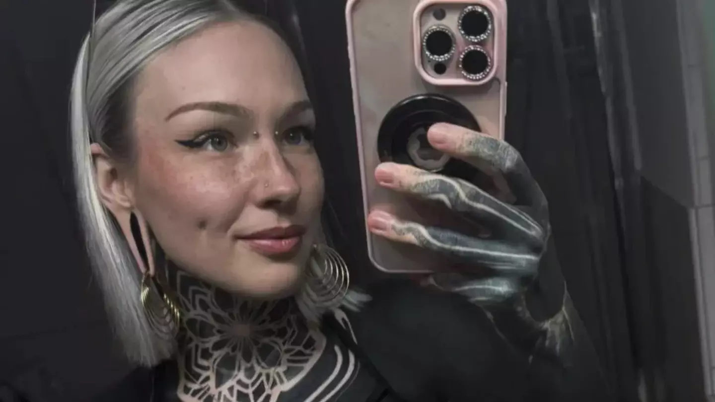 Woman hits back as she is accused of trying to ‘change race’ after tattooing 90% of body