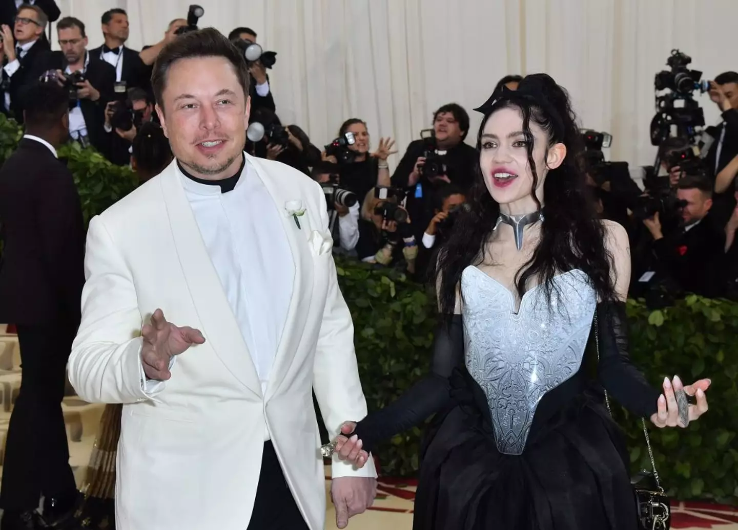 While Musk was busy playing with chainsaws, Grimes desperately tried to contact his team about a medical emergency involving their child (ANGELA WEISS/AFP via Getty Images)